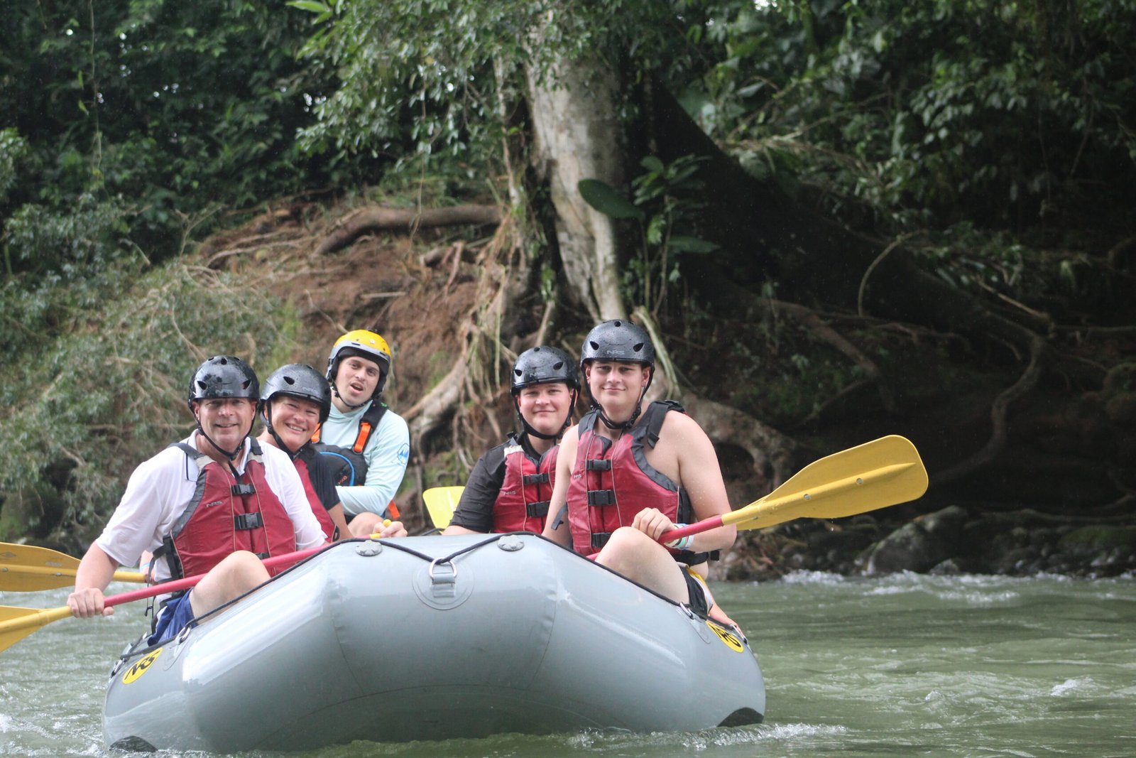 family raft floating